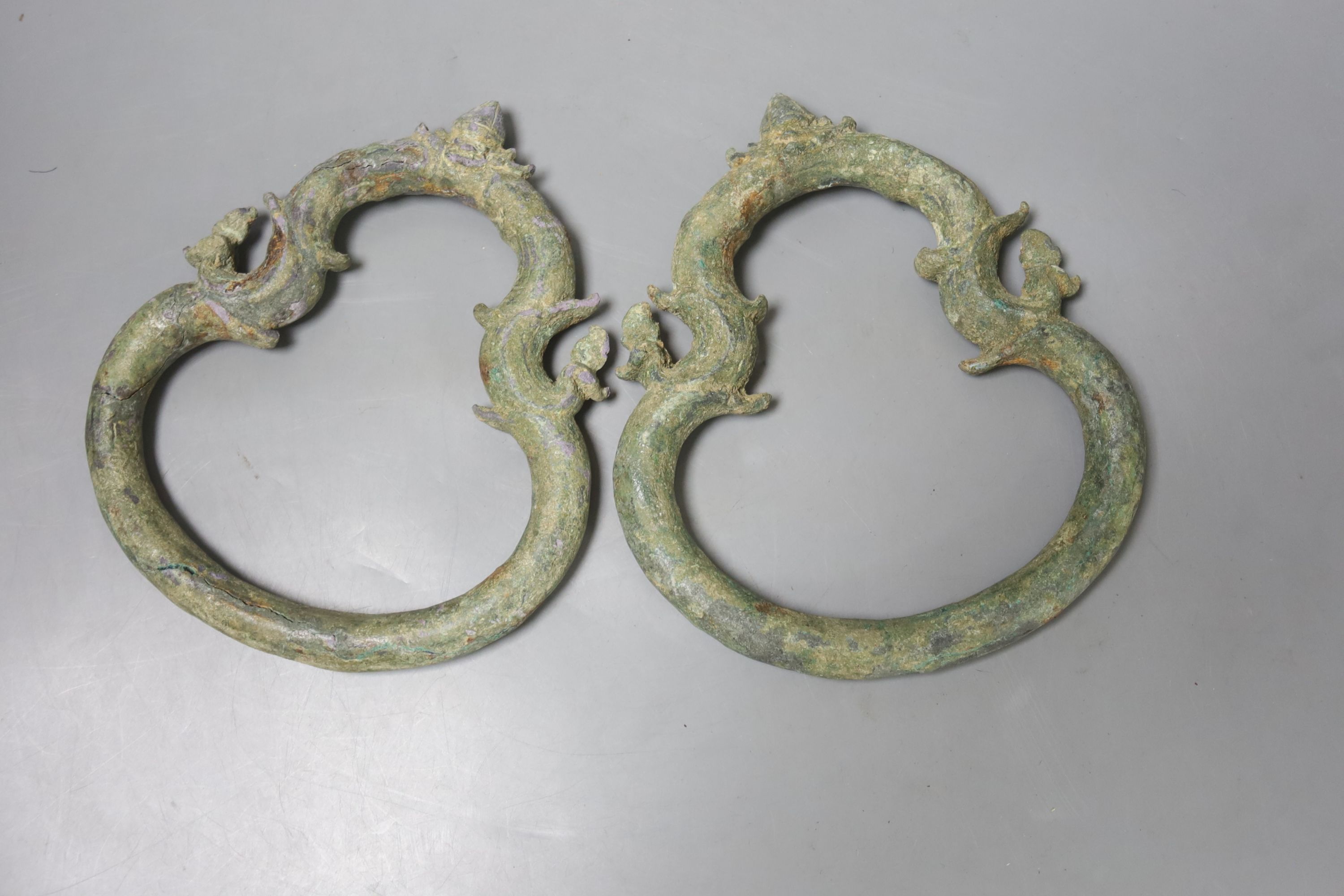 A pair of Cambodian bronze Palanquin handles, Khmer, 12th/13th century